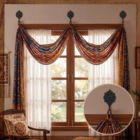 Six Pack Rock Solid Cast Iron Wall Hooks With Rustic Indian Leaf Design Heavy Duty Matte Black Finish Hangs Your Duds Securely For Farmhouse Vibe Or Everyday Storage Includes Hardware holding colorful draped curtains above a window.