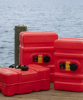 Portable 12 Gallon Marine Gas Can With Built In Fuel Gauge And Pick Up Cap 2 Way Vented Cap Easy To Carry Handles EPA And CARB Compliant Large Capacity Boat Fuel Tank For Outboard Motors displayed on dock with two similar cans in the background.