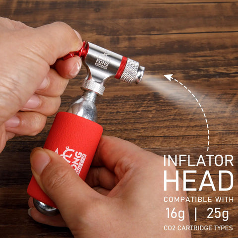 Close-up of a CO2 inflator being used from the Grab-And-Go 8-In-1 Bike Repair Kit With CO2 Inflator And Cartridges on wooden table.