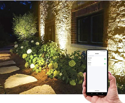 2.4Ghz WiFi Bluetooth RGB Landscape Lights Kit illuminating garden with smartphone app control visible