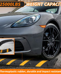 Car crossing a two pack recycled rubber speed bump set with 25,000 pound capacity durable cable protector ramp for driveways.