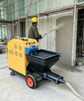 Portable Cement Mortar Spraying Machine For Professional Wall Plastering Stucco Render Equipment in action on jobsite.