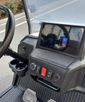Interior view of sleek white two seater electric golf cart with touchscreen, controls, and cup holder. Kick Back In Comfort On This Sleek White Two Seater Electric Golf Cart Powered By A Dependable 48V Lithium Battery All Weather Dash Switches And Sure Grip Tires For Every Epic Course Round.