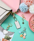 25 Heavy Duty Metal Swivel Clasp Hooks And One Inch D Ring Keychain Making Kit Featuring Smooth Lobster Claw Clasps across a purse and keychains.