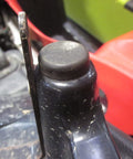 Close-up of an ATV seat mount with a rubber bumper grommet from the Seat Box and Seat Mount Rubber Bumper Grommet Set 6 Pack Replacement for ATV Seat Mounts and Cargo Boxes, Reduces Vibration and Rattles, Keeps Your Ride Tight, Restores Proper Spacing and Solid Support.