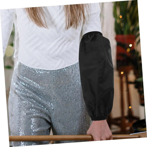 Oilproof Long Arm Sleeves For Men And Women With Heavy Duty Gunk Shielding worn by a person in a white top and shiny pants.