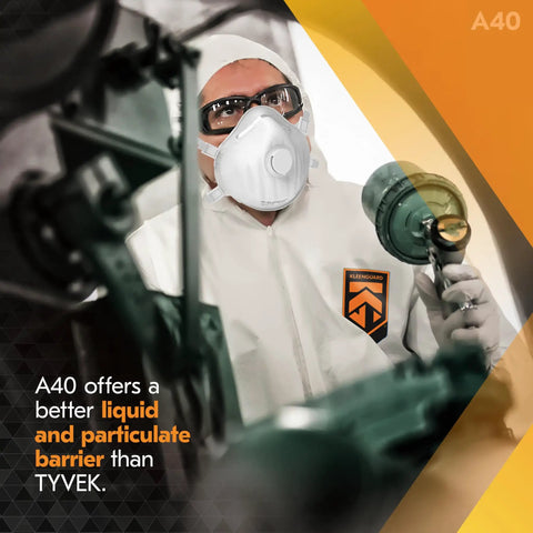 Worker in A40 Liquid And Particle Protective Coveralls With Zipper Front White 2XL Case Of 25 in industrial setting.
