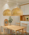 Natural Bamboo Pendant Light With Handwoven Wicker Lampshade And Wood Canopy Eco Friendly Ceiling Fixture in dining area.