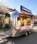 Commercial Grade 13 Foot Stainless Steel Food Trailer With Slick Mirror Polish DOT Certified Turnkey Mobile Kitchen Setup on street.