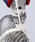 Electronics Precision Snips 5.5-Inch Diagonal Cutters cutting a plastic cable tie on a metal coil
