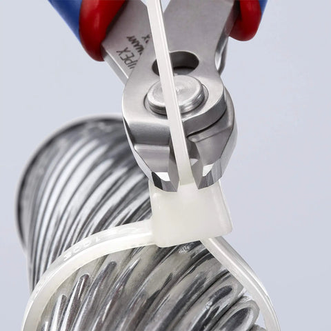 Electronics Precision Snips 5.5-Inch Diagonal Cutters cutting a plastic cable tie on a metal coil