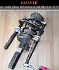 Heavy Duty Coil Spring Compressor Tool For MacPherson Struts Built Tough With Extendable Safety Bracket in use on floor