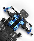 Close-up of TG Racing Carbon Fiber RC Car Frame Kit 1/24 1/28 Scale Rear Wheel Drive RWD Drift Chassis with blue components