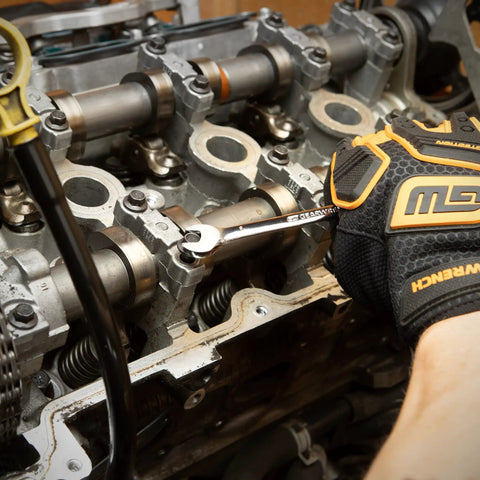 Mechanic using 30 Piece 12 Point Ratcheting Wrench Set SAE And Metric 1/4 To 1 Inch And 8-24 mm on engine component