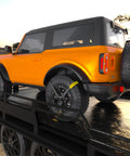 Beefy Rugged Car Tie Down Straps For Trailers 2 Inch Wide By 10 Foot Long With 10000 Pound Break Strength securing an SUV