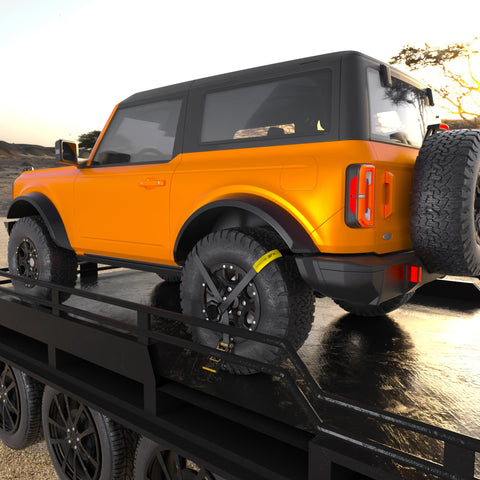 Beefy Rugged Car Tie Down Straps For Trailers 2 Inch Wide By 10 Foot Long With 10000 Pound Break Strength securing an SUV