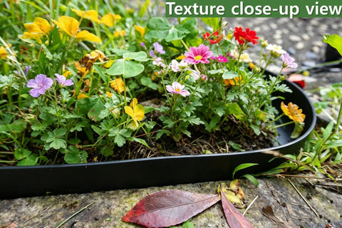 60 Foot Plastic Landscape Edging No Dig Black Lawn Border With 72 Stakes shown as grass barrier with flowers