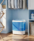 No Sweat Portable Twin Tub Wash And Spin Combo 9.9 Pounds Mini Top Load Laundry Machine in a corner with clothing.