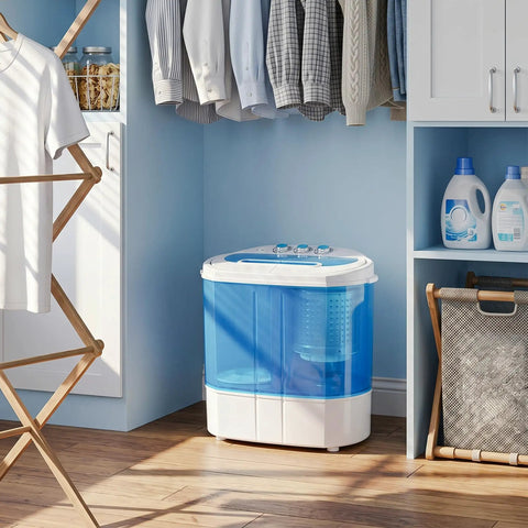 No Sweat Portable Twin Tub Wash And Spin Combo 9.9 Pounds Mini Top Load Laundry Machine in a corner with clothing.