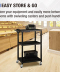Mobile AV Cart With Power Strip And Casters in classroom, rolling media cart with adjustable shelves for quick setup, black