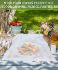 7 Pack Outdoor Mesh Food Covers Set With One Extra Large 40 By 24 Inch And Six Standard 17 Inch Covers over fruit platter