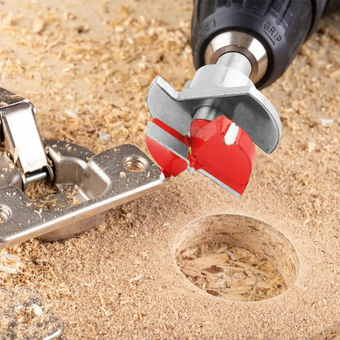 Close up of 35mm Forstner Bit and Concealed Hinge Jig Set 5 Piece Kit cutting a hole in wood for cabinet doors.