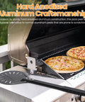 Leightszen pizza turning peel with perforated circular blade and black handle on grill