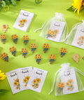 Total Vibe Bulk Sunflower Enamel Pins For Women Includes 25 Gold Yellow Flower Lapel Brooches With Thank You Cards And Tissue Wraps displayed with organza bags and floral thank you cards.
