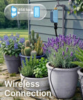 WiFi Water Timer For Garden Hose With Heavy Duty Brass Inlet And Flow Meter, shown on a garden wall controlling outdoor irrigation.