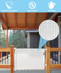 Outdoor view of 33 Inch Tall Baby Gate For Doorways Retractable Mesh Gate For Kids And Pets Anti Climb Design For Wide Openings Up To 100 Inches