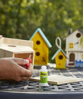 Multipurpose Brush On Super Glue Six Count Pack Quick Drying Liquid Adhesive Zero Hassle Applicator used on wooden birdhouse.