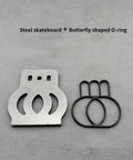 Steel skateboard insert and butterfly shaped O-ring on grey background