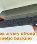 Close-up of AC Drip Cushion With Magnetic Backing Black 24 X 19.6 Inches in hands showing strong magnetic backing
