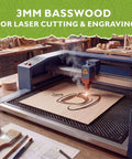 Basswood sheet 12x12 on blue laser cutter being engraved, smoke rising.