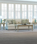 Living room with 28.25 Inch Tall Porcelain Table Lamp With Teal And Taupe Two Tone Finish, white linen French drum shade on end tables
