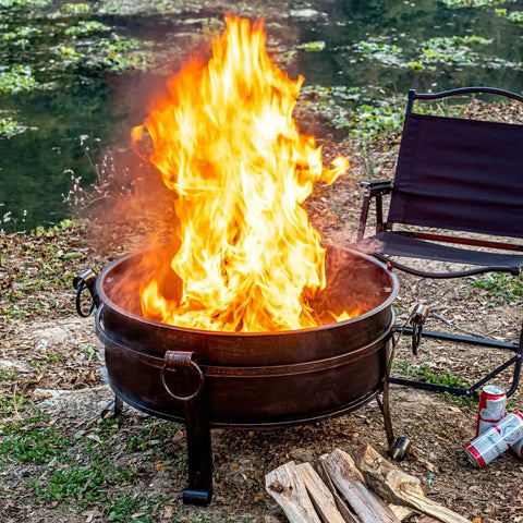 36 Inch Outdoor Fire Pit With Grill N Chill And Lid All In One Round Table For Patio Barbecues Heavy Duty Wood Burning Fire Pit With Poker Log Grate And Waterproof Cover For Easy Outdoor Cooking And Cozy Evenings on a patio with chairs