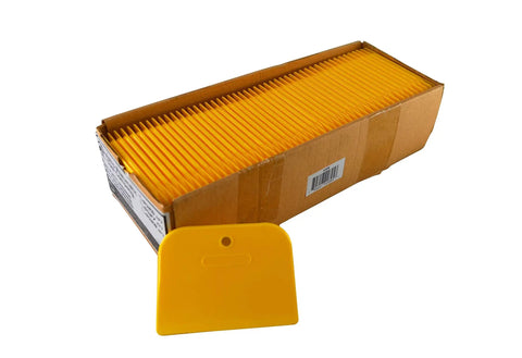 Box with yellow spreaders and a single Yellow 4 Inch Plastic Spreader Set Of 100 Durable DIY Caulking And Paint Spreaders