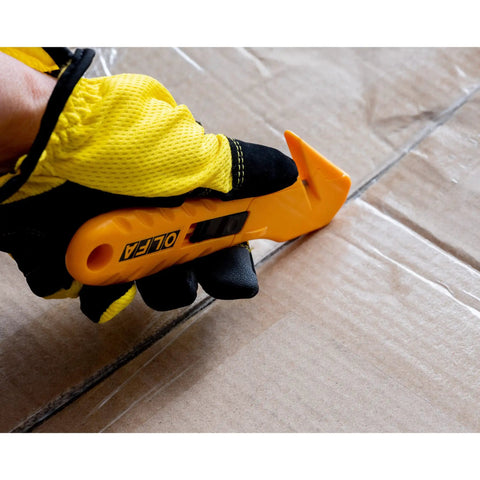 Concealed Blade Safety Knife With Protected Blade For Tape Slitting And Packaging Tasks 4mm Throat Delivers Continual Safe Blade Exposure And Easy One Hand Use For Shipping Warehousing And DIY Jobs, gloved hand cutting cardboard