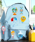 24 Pack Science Theme Make Your Own Face Stickers on blue backpack, featuring science designs for DIY crafts and party games