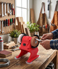 Badass Compact Mini Bench Grinder With 70mm Grinding Wheel 5500 RPM Speed being used on a workbench for sharpening tasks.