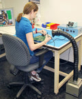 Woman using Portable Solder Fume Extractor With Pro Grade Lightweight Build ESD Safe Base Tool Free Filter Change