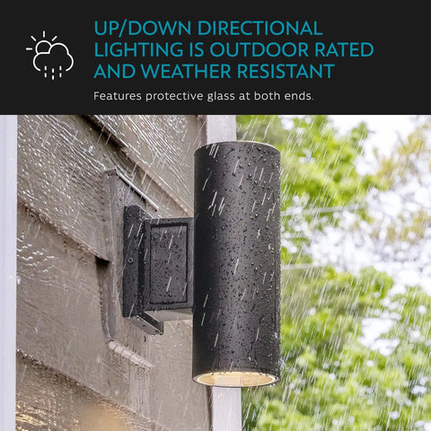 Carter 2-Light Outdoor Wall Lantern With Built-In GFCI Outlet In Aged Bronze, mounted on wall in rain, highlighting weatherproof design.