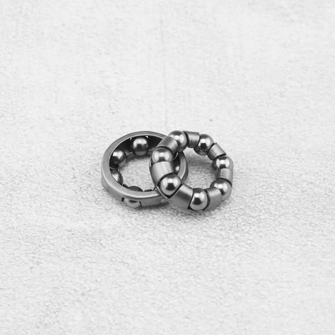 4 Pack Bike Ball Bearing Retainer Cage With 7 Balls for Front Wheel Bearing Bracket on gray background