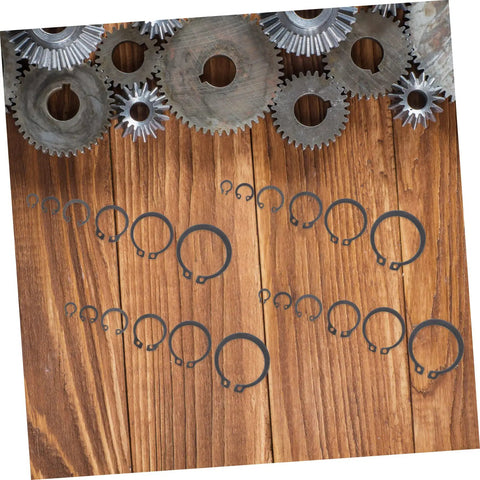 225 Piece Carbon Steel C Shape Retaining Ring Kit External Snap Rings with gears on wooden background