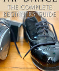 Straight Up Elevate Your Shoe Game With This Killer Tap Dance Beginners Guide Full Of Easy Rhythm Steps Pro Footwork Tricks Fun Moves And Jazz Basics That Actually Make You Feel Fly with black tap dance shoes on a wooden floor.