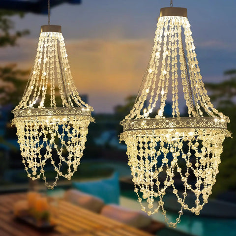 Give Your Outdoor Patio A Major Glow Up With This Stunning Handcrafted Solar Crystal Chandelier Featuring Cascading Diamond Sparkles And Weather Proof White Metal Frame, showcasing illuminated crystal strands.