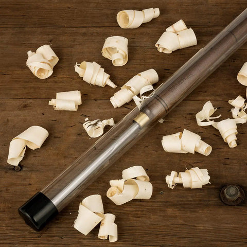 Three Eighths Inch HSS Bowl Gouge Lathe Chisel Set with 9 Inch High Speed Steel Blades in plastic case amongst wood shavings.