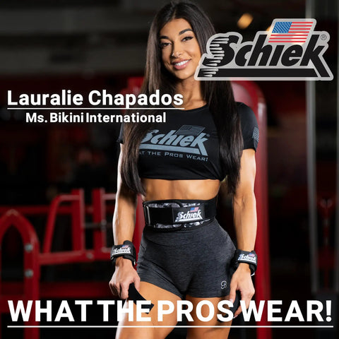 Fitness model posing in gym with Schiek fitness gear and branded equipment.