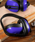 Six Pack Adjustable Safety Ear Muffs For Noise Reduction And Hearing Protection All Day Comfort For Hunting Shooting Construction And Woodworking Blue on a wooden surface