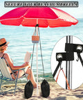 2 Pack Large Beach Umbrella Sand Bags Heavy Duty Waterproof Counterweights for Umbrella Bases and Tents Each Holds About 60 Lbs Includes Straps and S Hooks Portable Canopy Weight Kits for Outdoor Shade securing a red umbrella on a beach with a woman reading nearby.